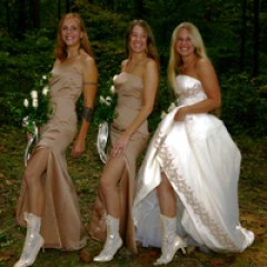 a couple of people that are standing in the grass