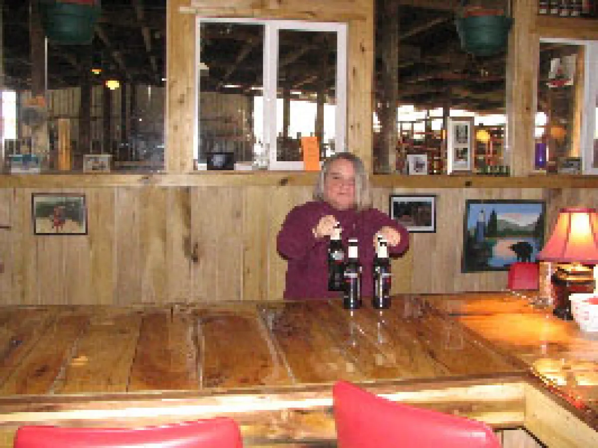 a person sitting at a table in a restaurant