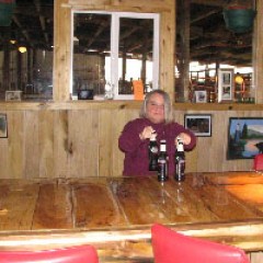 a person sitting at a table in a restaurant