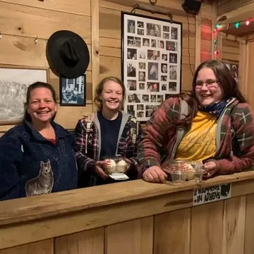 a group of people performing on a counter