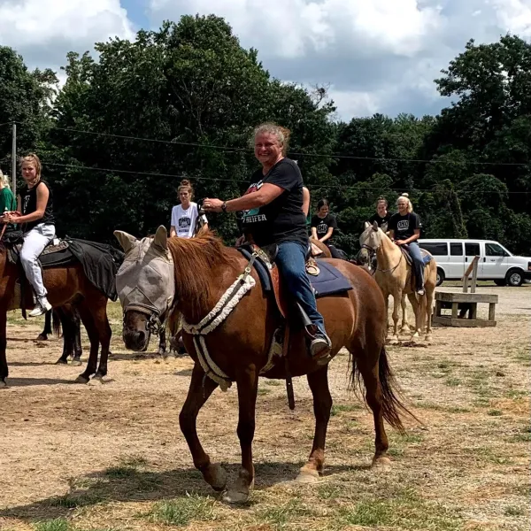 a group of people riding on the back of a horse
