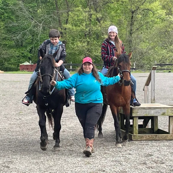 a group of people riding on the back of a horse