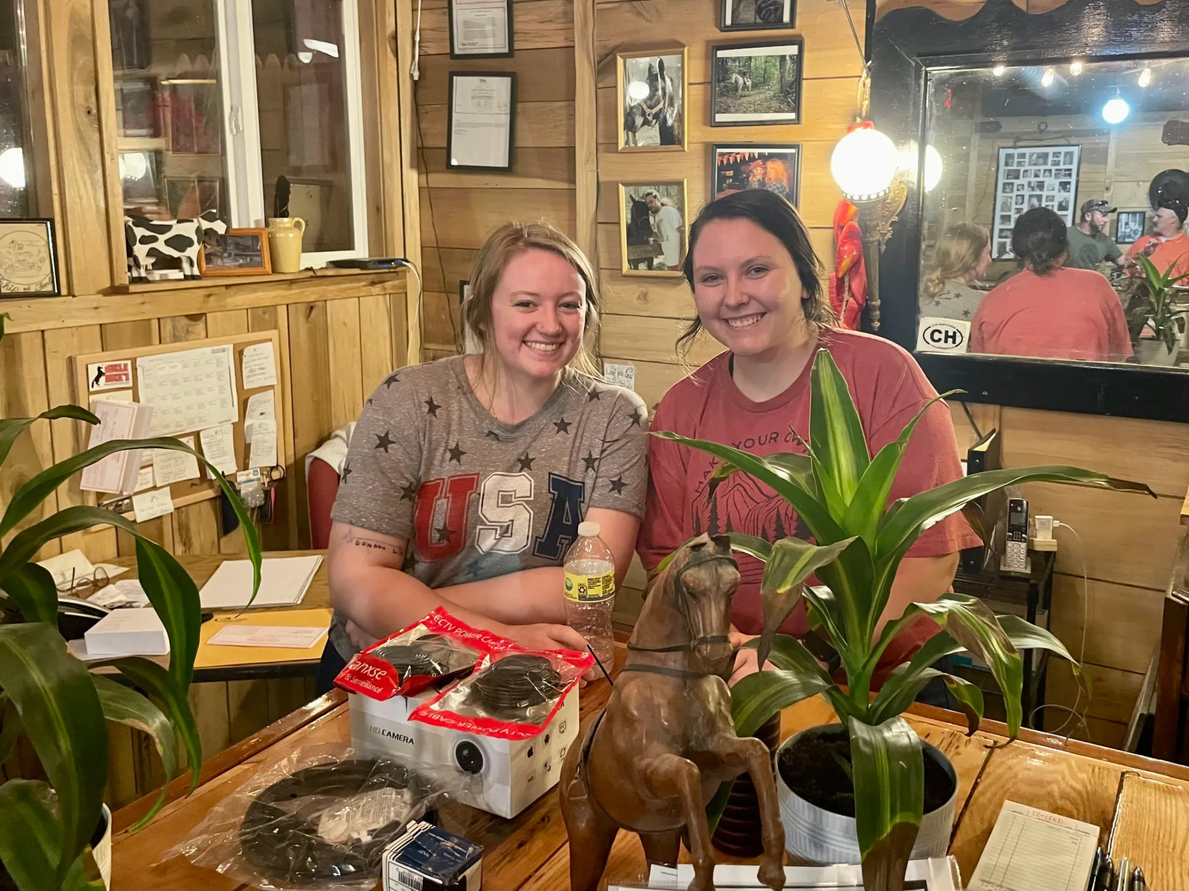 a man and a woman sitting at a table posing for the camera